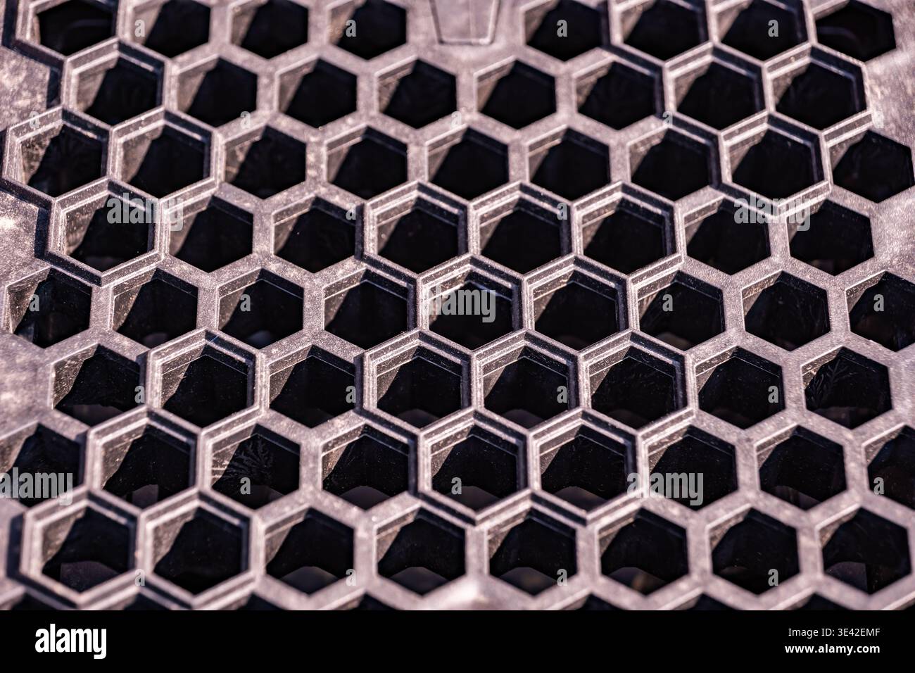 Honeycomb pattern structure creating an abstract geometric grid background texture Stock Photo