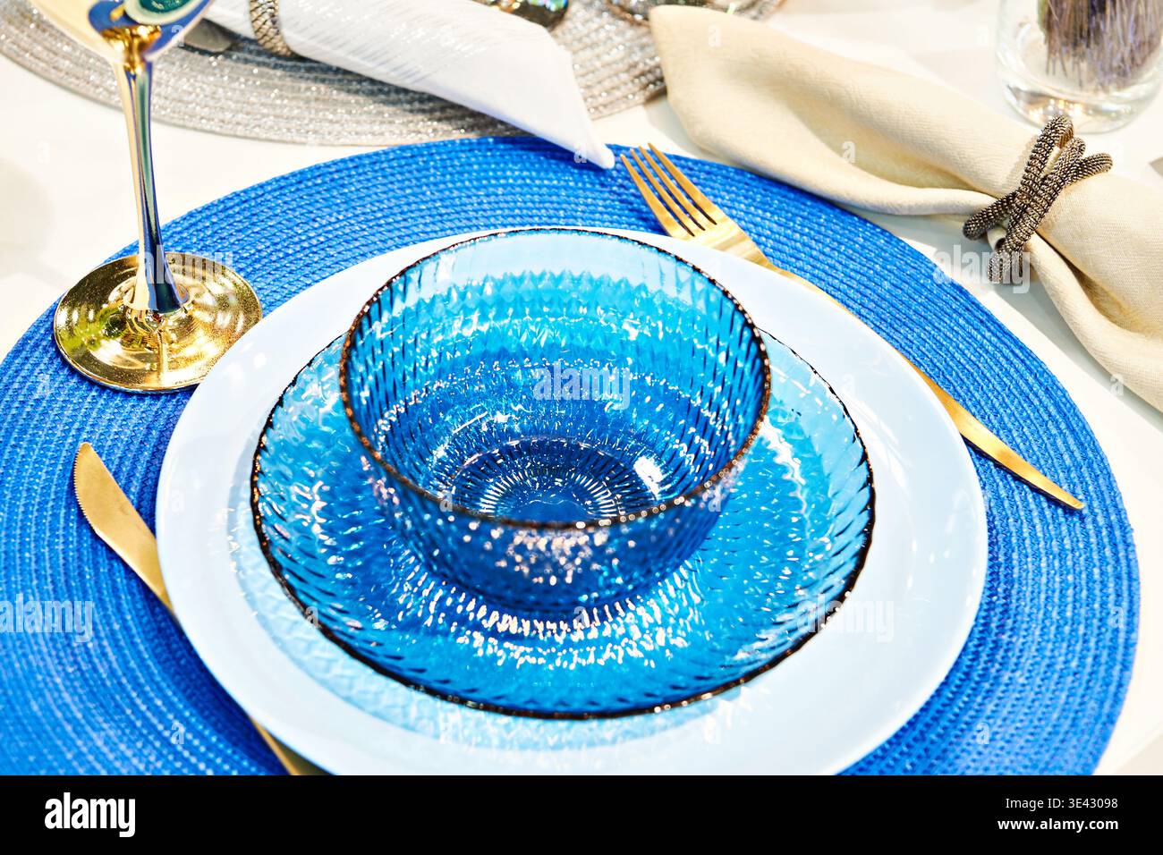 Blue glass plates on the festive table Stock Photo