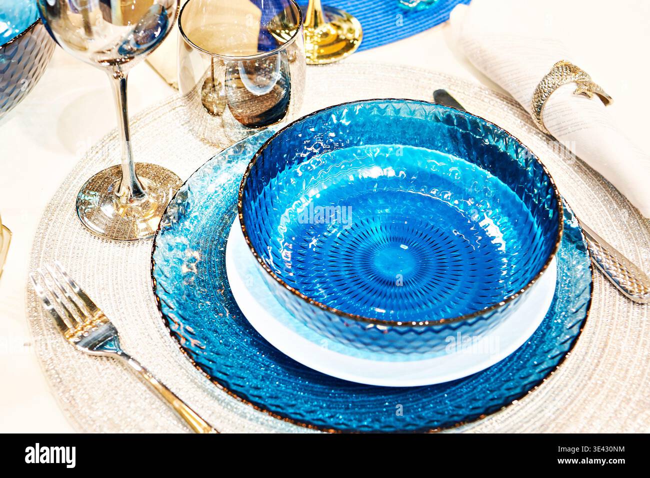 Blue glass plates on the festive table Stock Photo