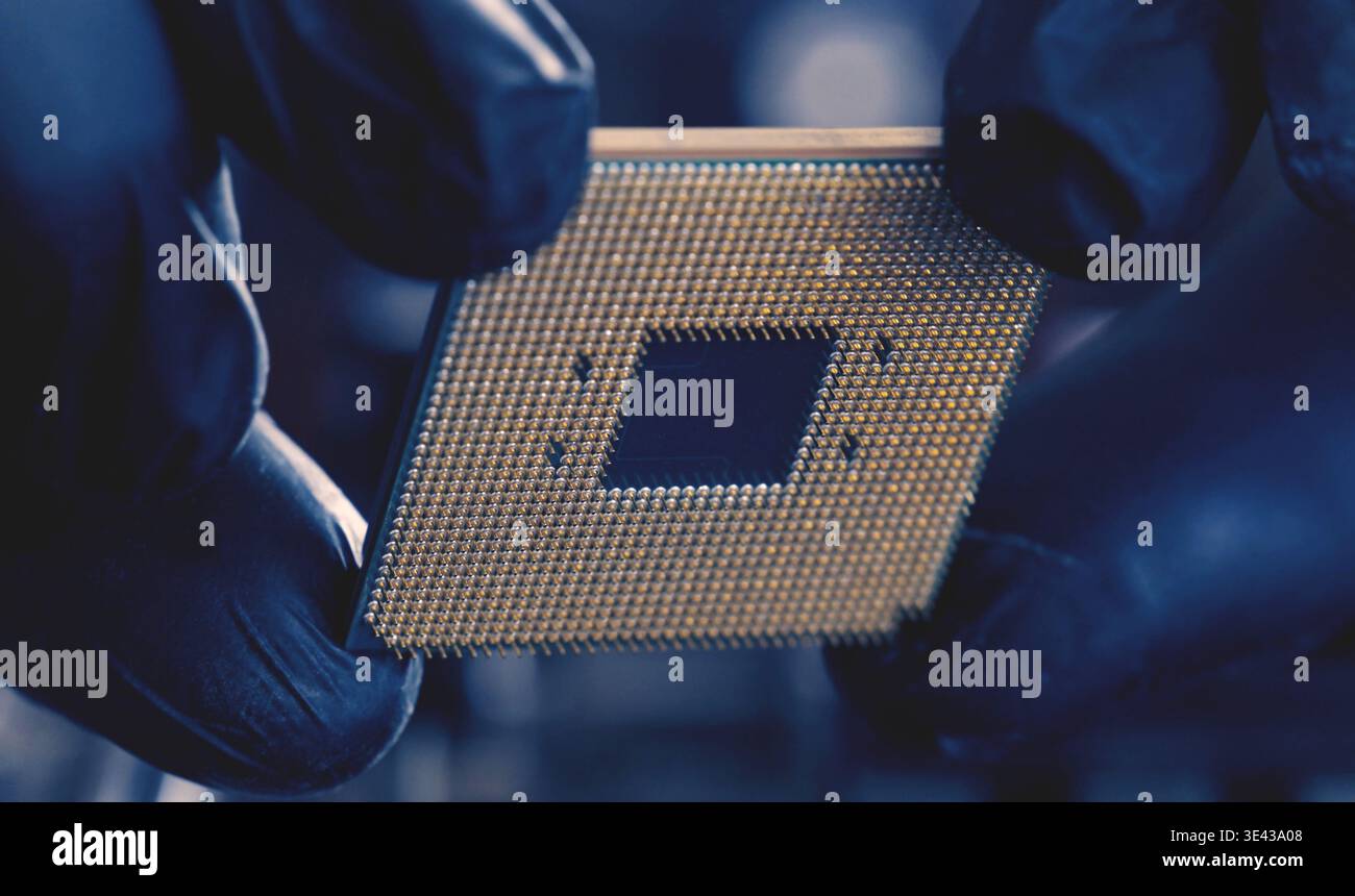 Close-Up View Of Computer Technician Holding Pc Processor Stock Photo