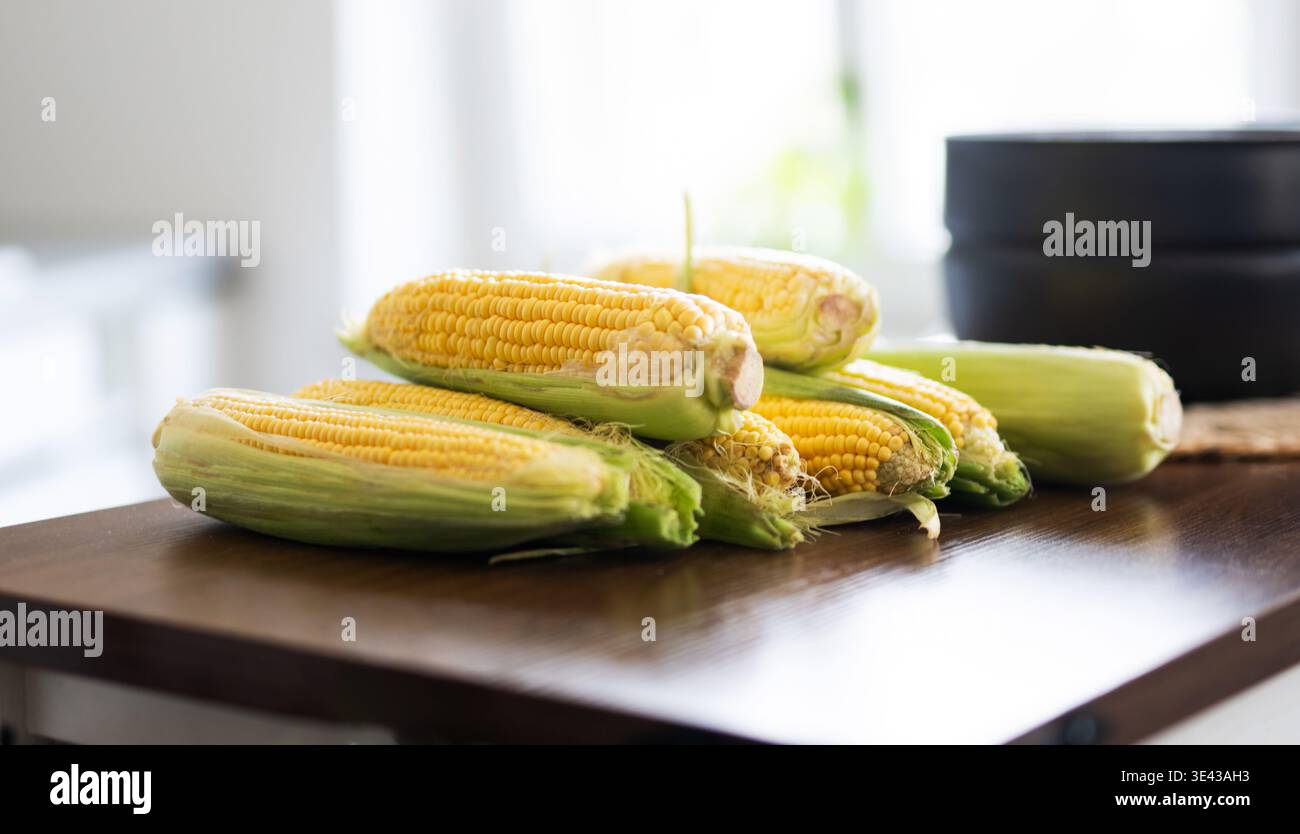 Fresh Raw Corn Cobs On A Kitchen Table For Boiling Stock Photo