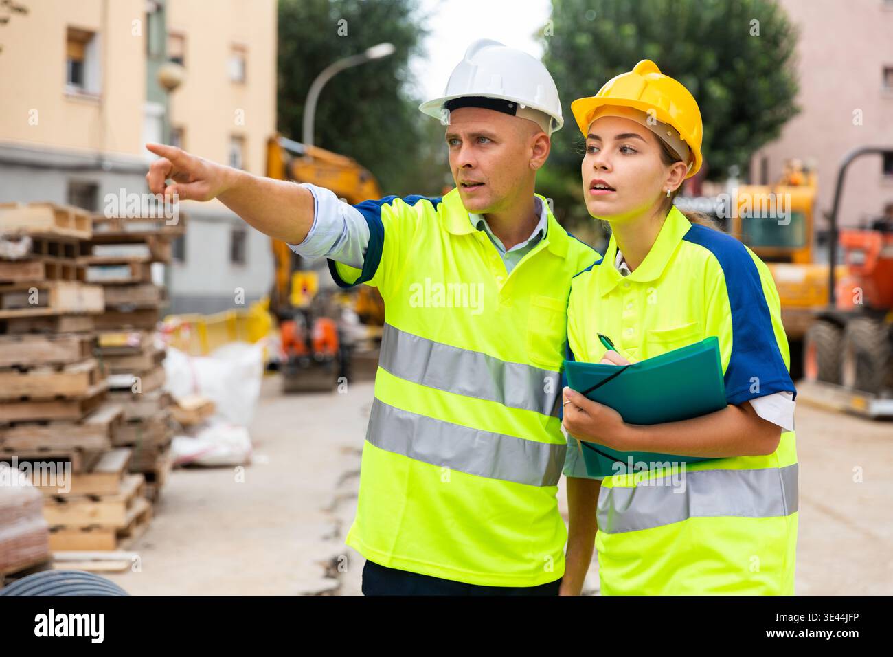 Two qualified engineers are discussing a construction plan Stock Photo