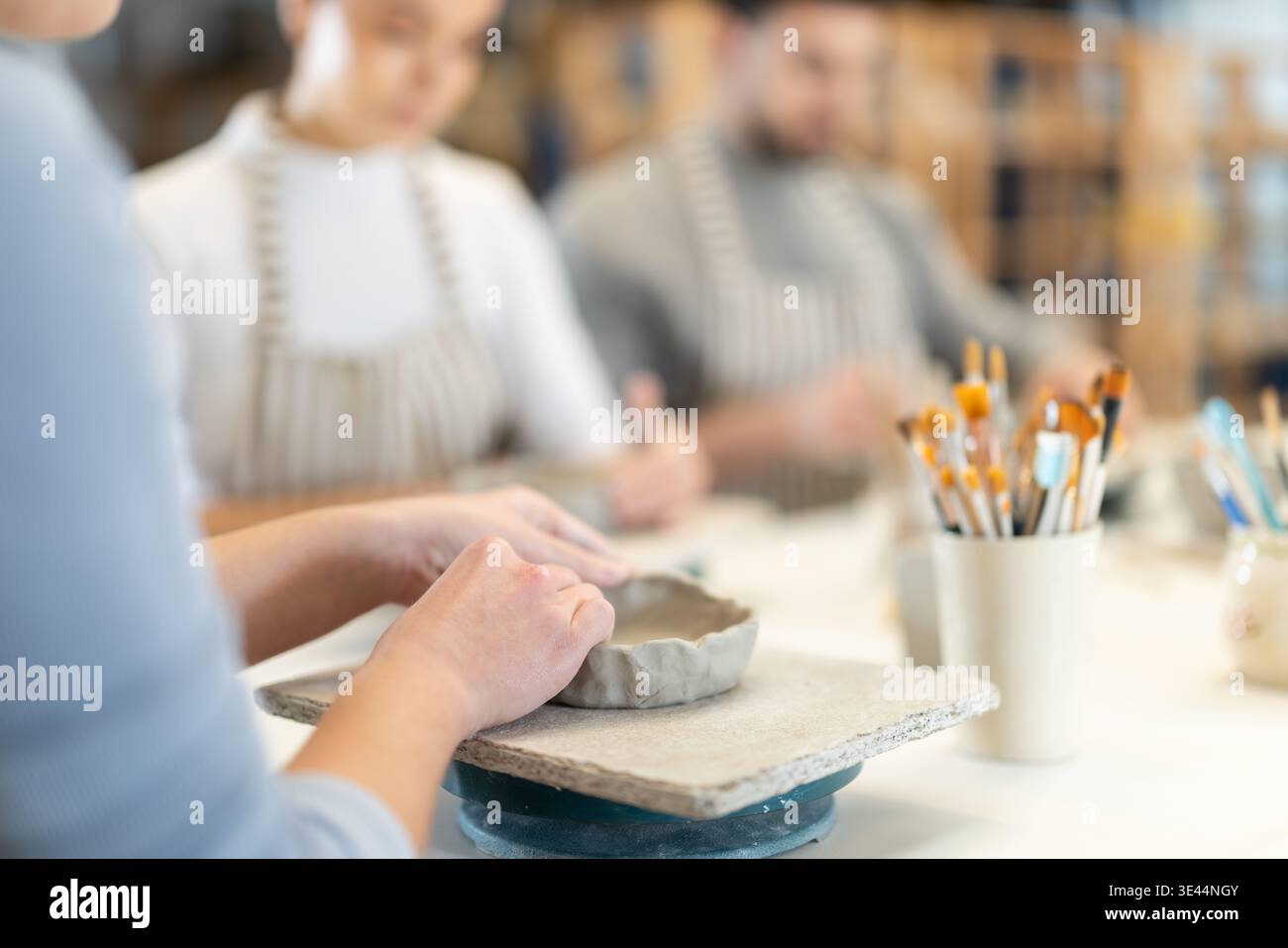 Close up master forms bowl of clay during master class Stock Photo