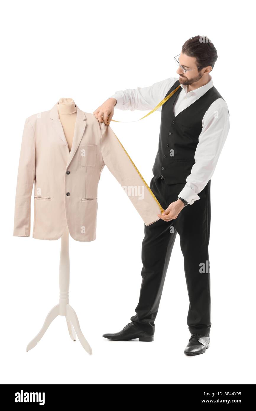 Male tailor measuring jacket on white background Stock Photo