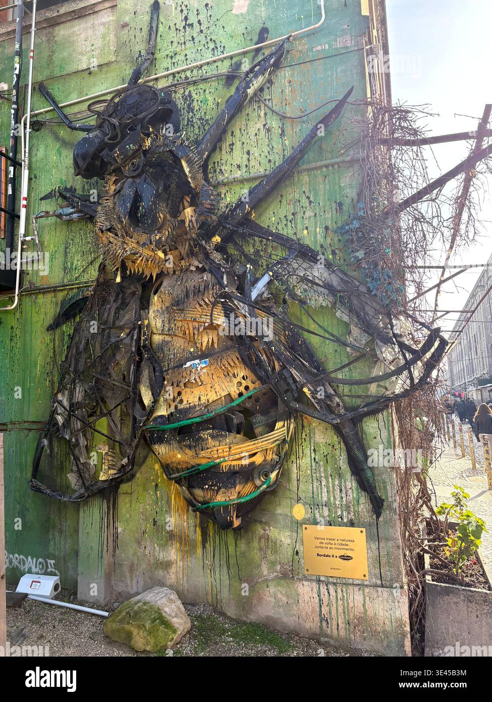 Giant Bee Sculpture Made from Recycled Waste on Green Building in Lisbon - Smartphone Captured Stock Image