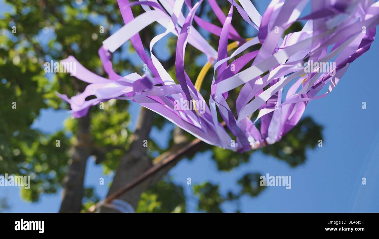Purple ribbons fluttering in wind at India Day festival in Moscow park ...