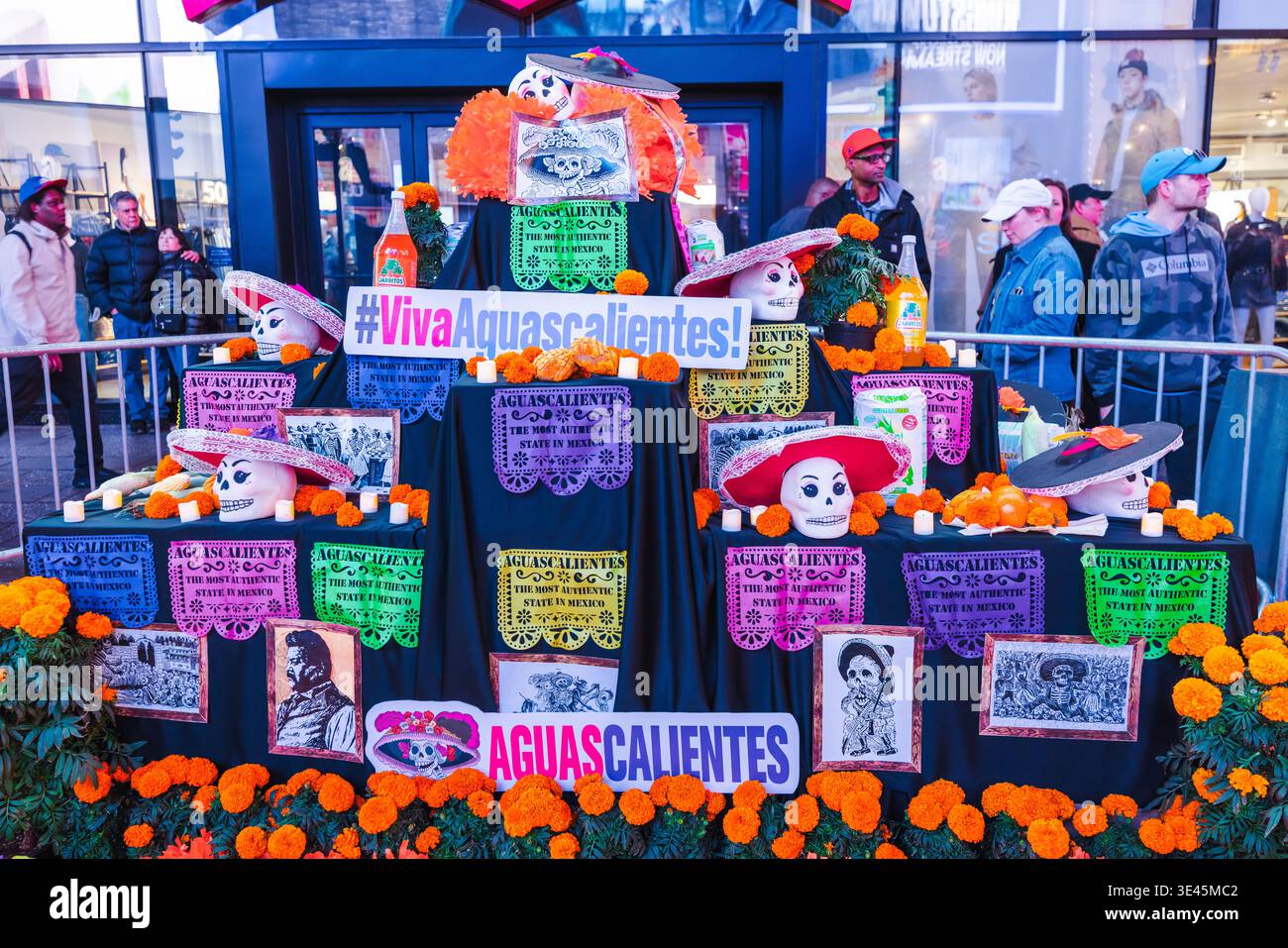 New-York, USA, 2 November 2025: Day of the Dead altar display with colorful skull decorations and marigold flowers at Times Square New York  Stock Photo