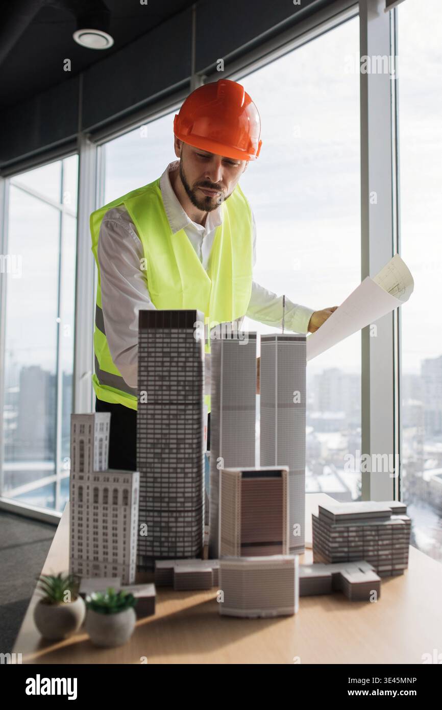 Architect Reviews Building Models Stock Photo
