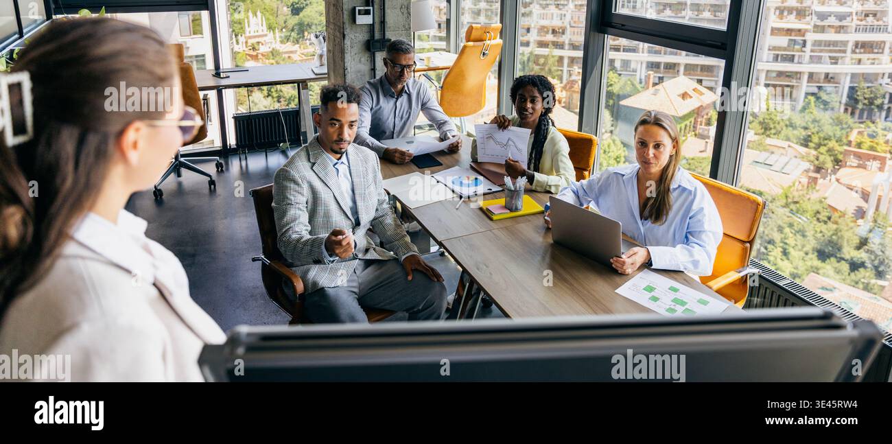 Creative team examines prototype with sketches and feedback discussions Stock Photo