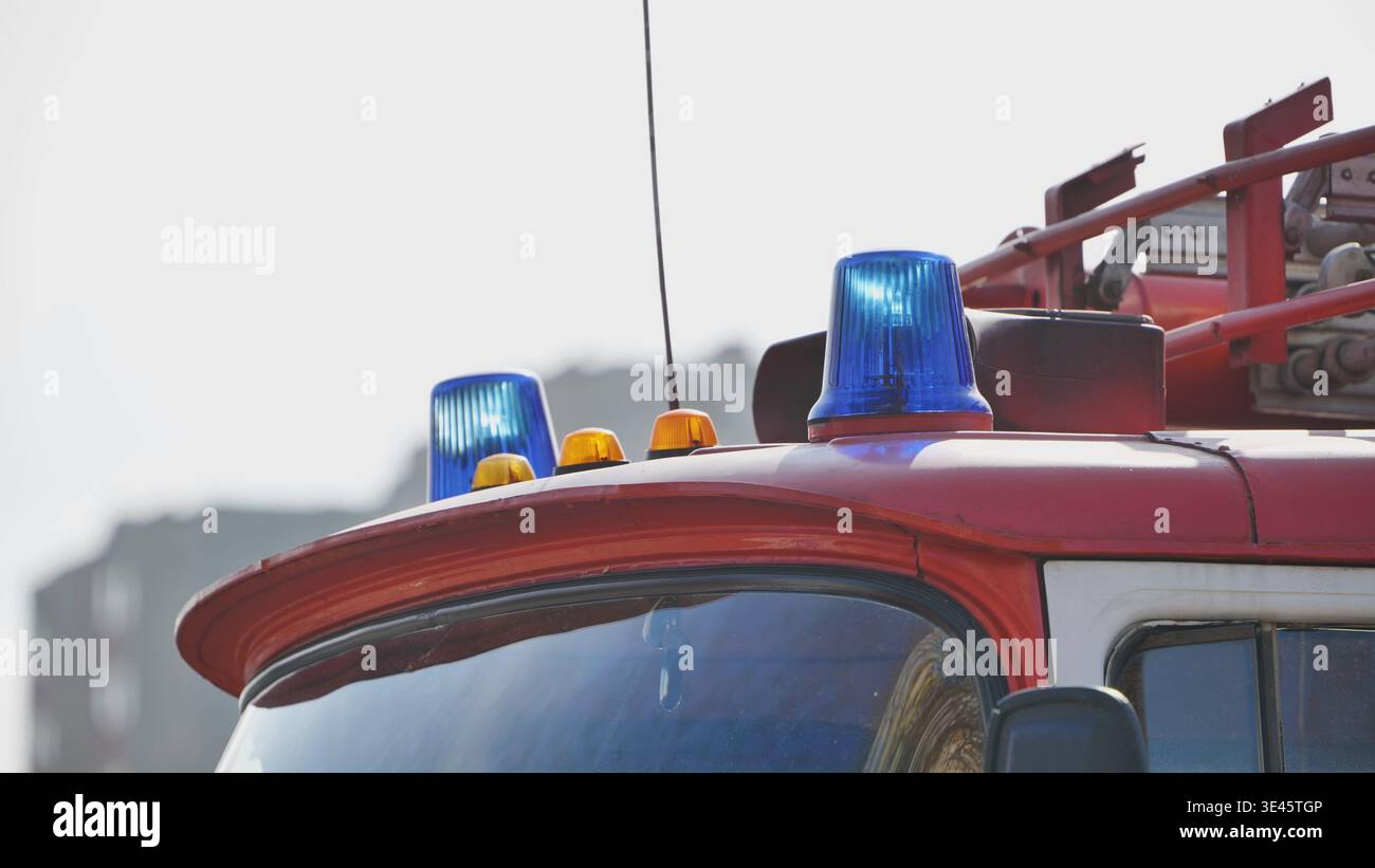 Flashing blue sirens on fire truck roof is announcing emergency ...