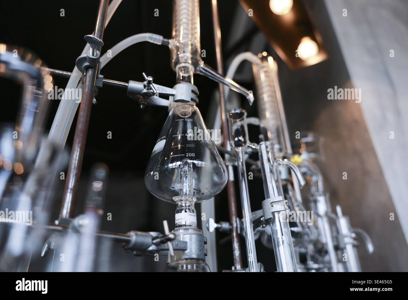 Complex glass laboratory distillation equipment setup featuring ...