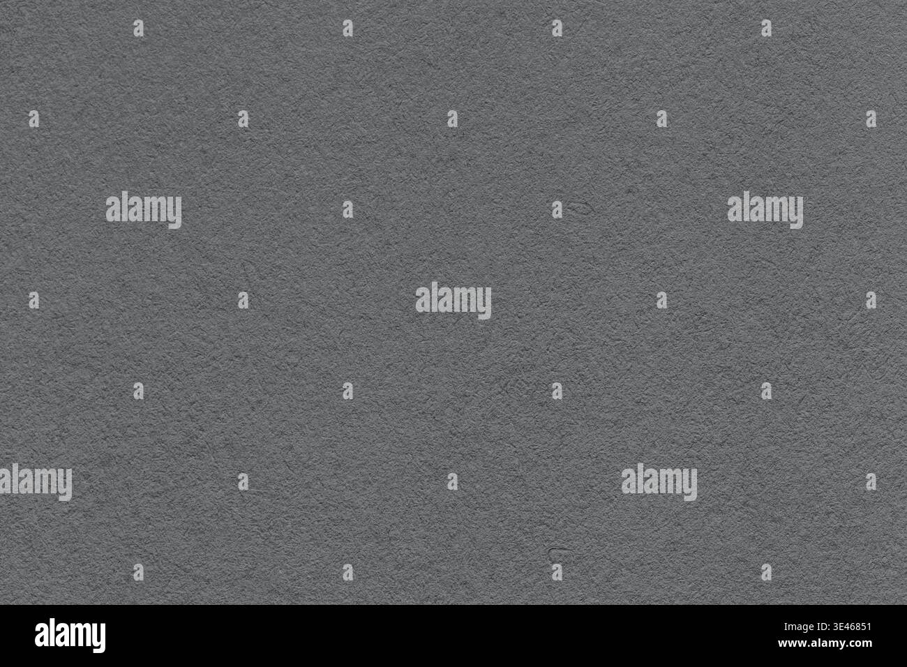 Dark gray textured paper background with subtle grain surface and soft structure. Graphite backdrop, macro. Stock Photo