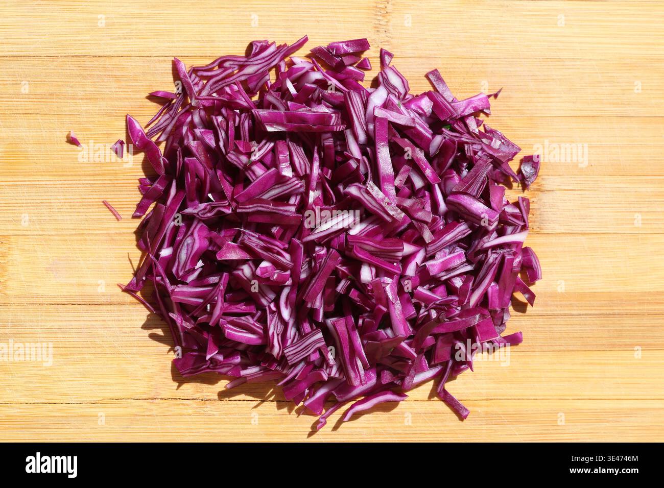 finely chopped red cabbage on the chopping board Stock Photo