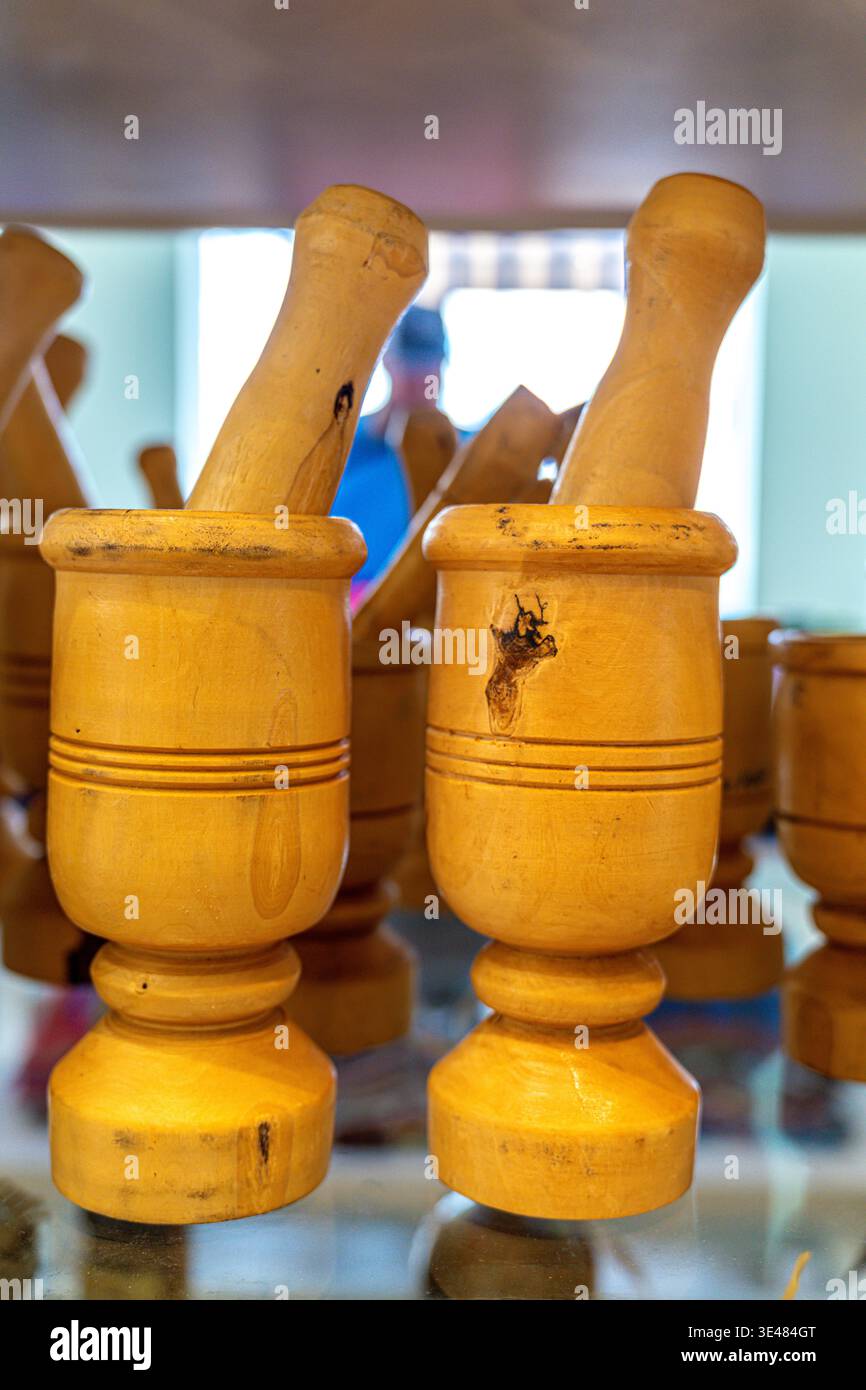 Set of mortar and pestle made of wood in shop Stock Photo