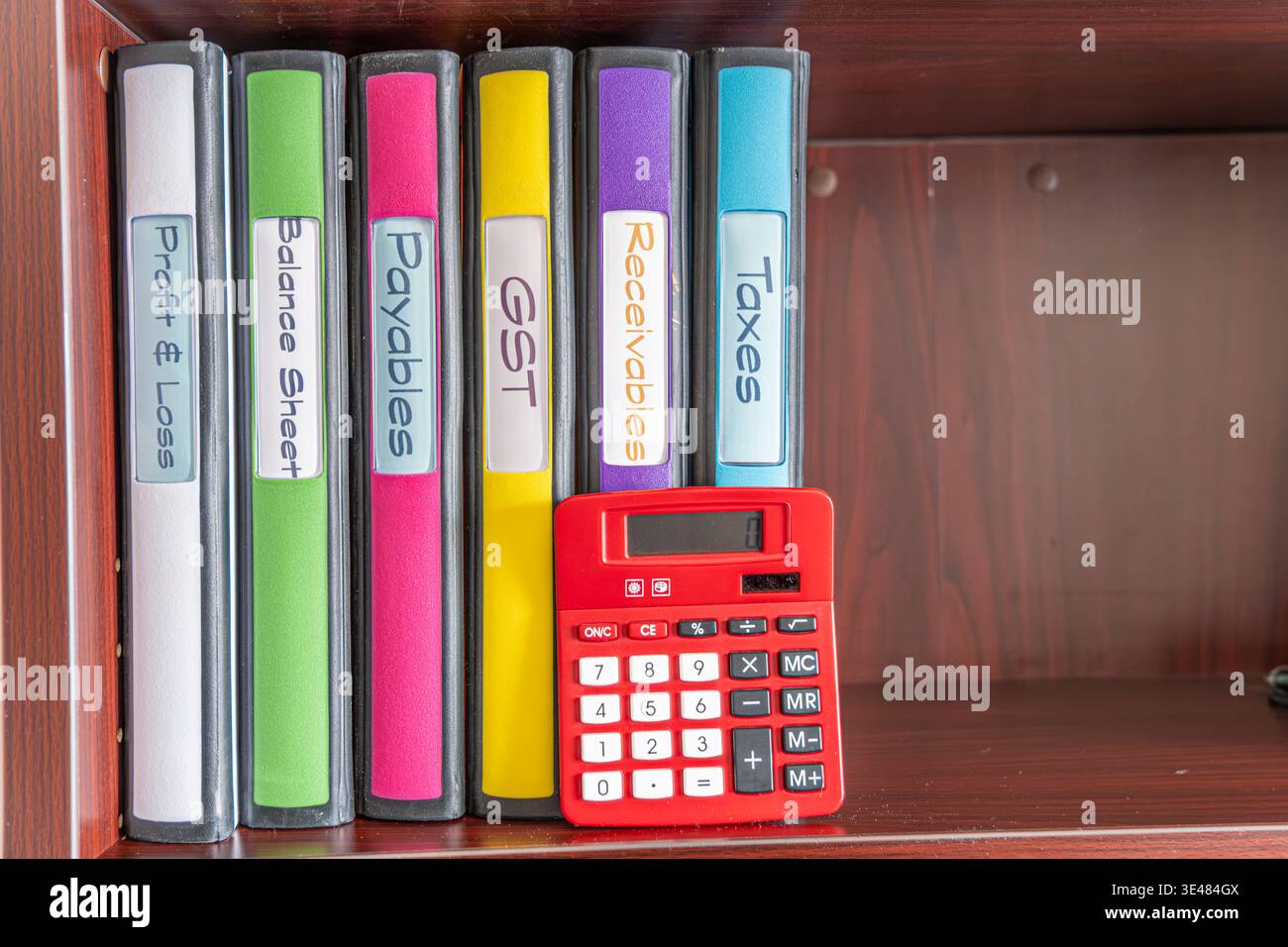 Files for preparing accounting year end with Calculator Stock Photo