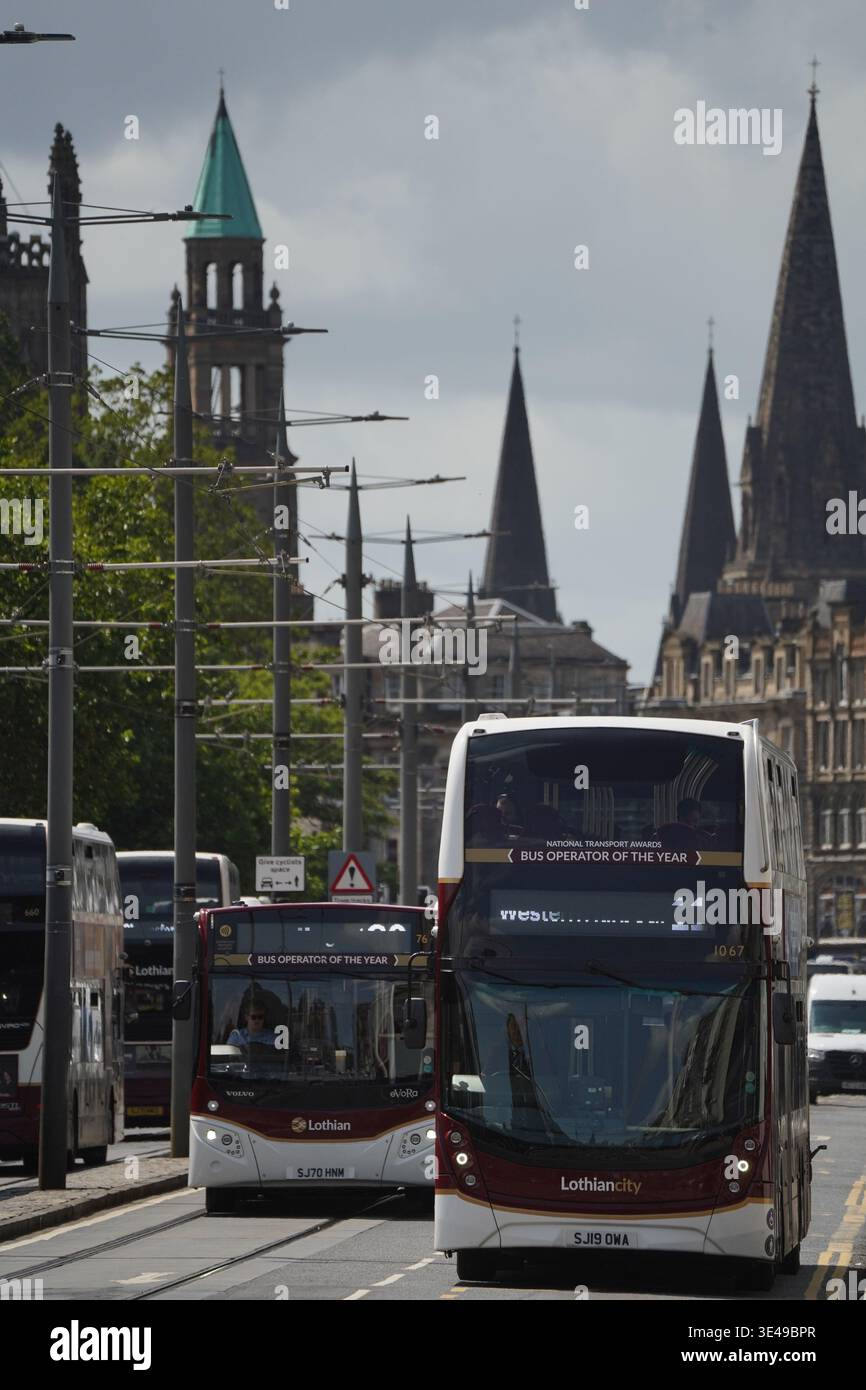Urban street scene looking east along Princes Street with Lothian Buses ...