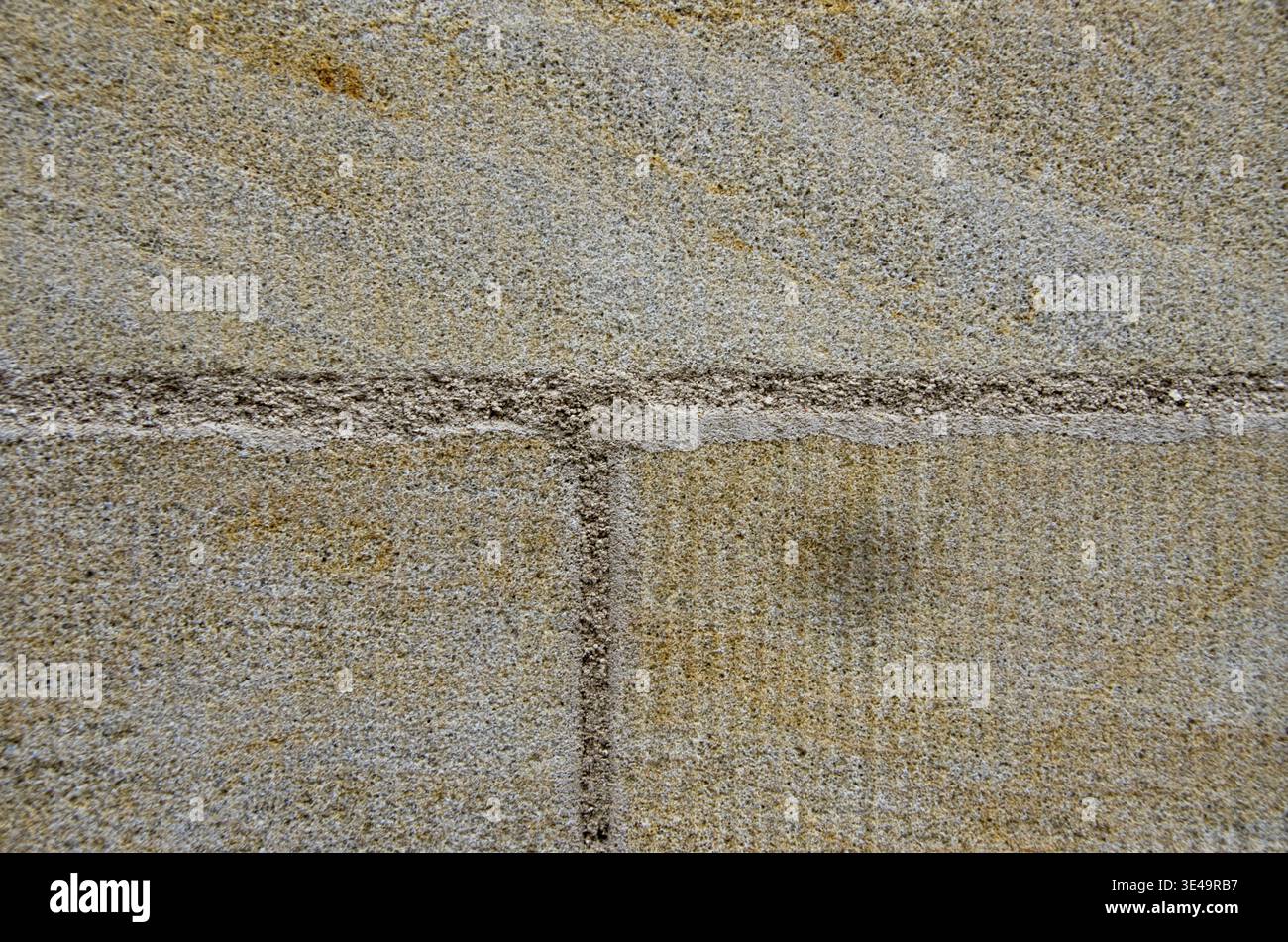 Sandstone wall showing natural patterns and rough granular surface Stock Photo