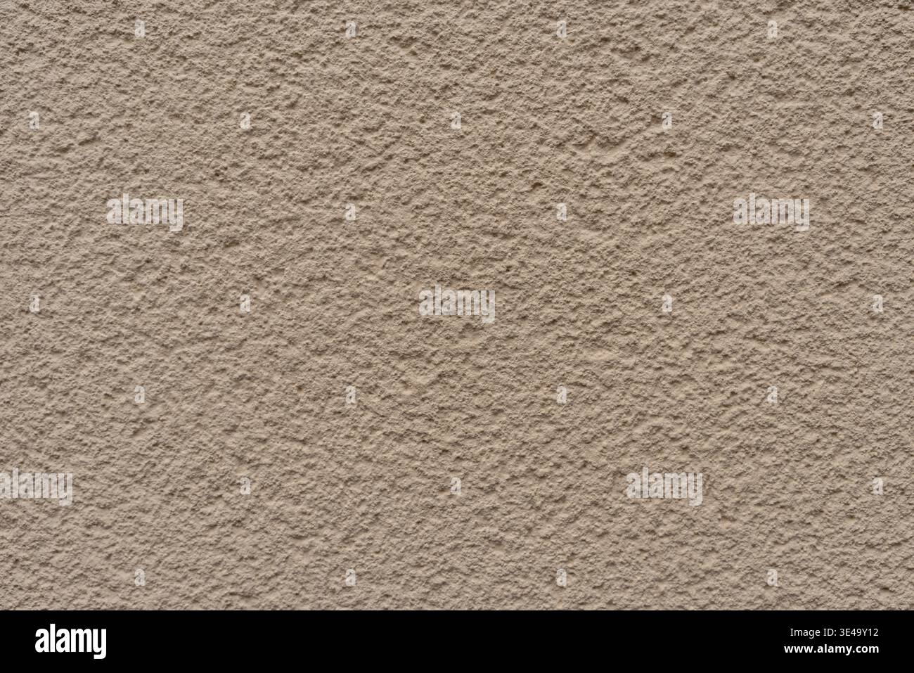 Beige colored stucco wall rough textured surface Stock Photo
