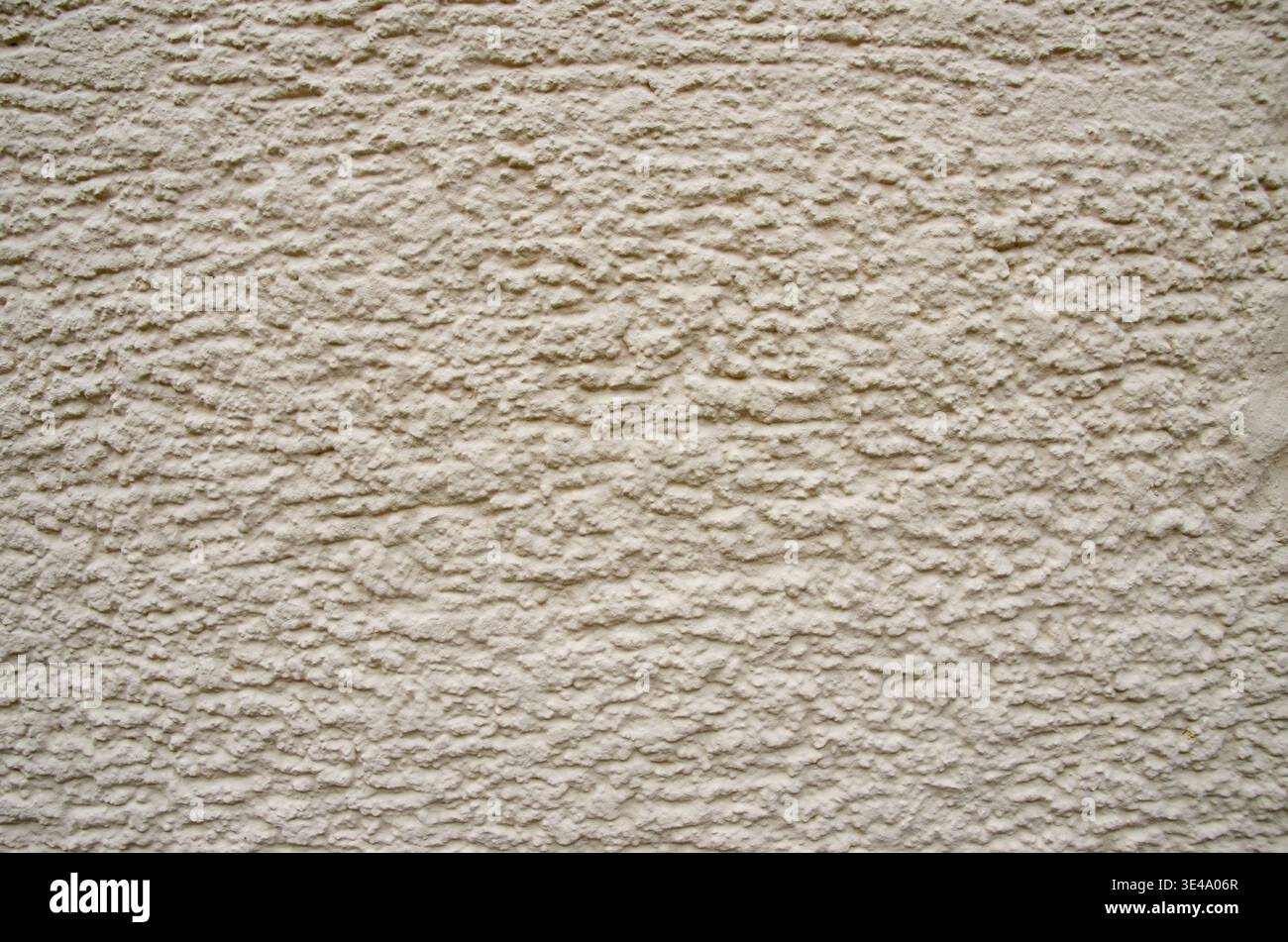 Beige stucco wall displaying rough plaster texture creating a solid background Stock Photo