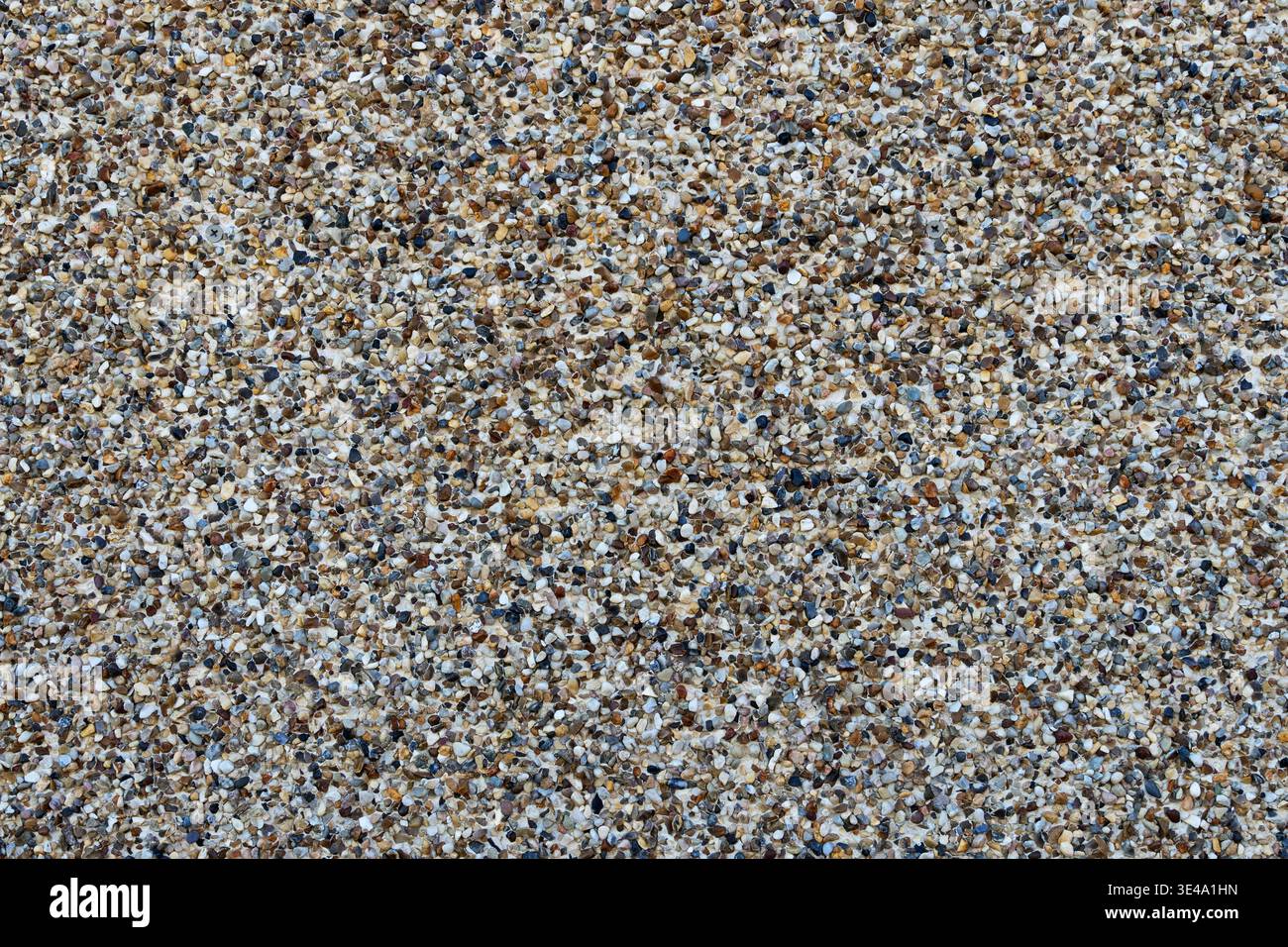 mixed pebble aggregate background surface texture on a precast wall panel Stock Photo