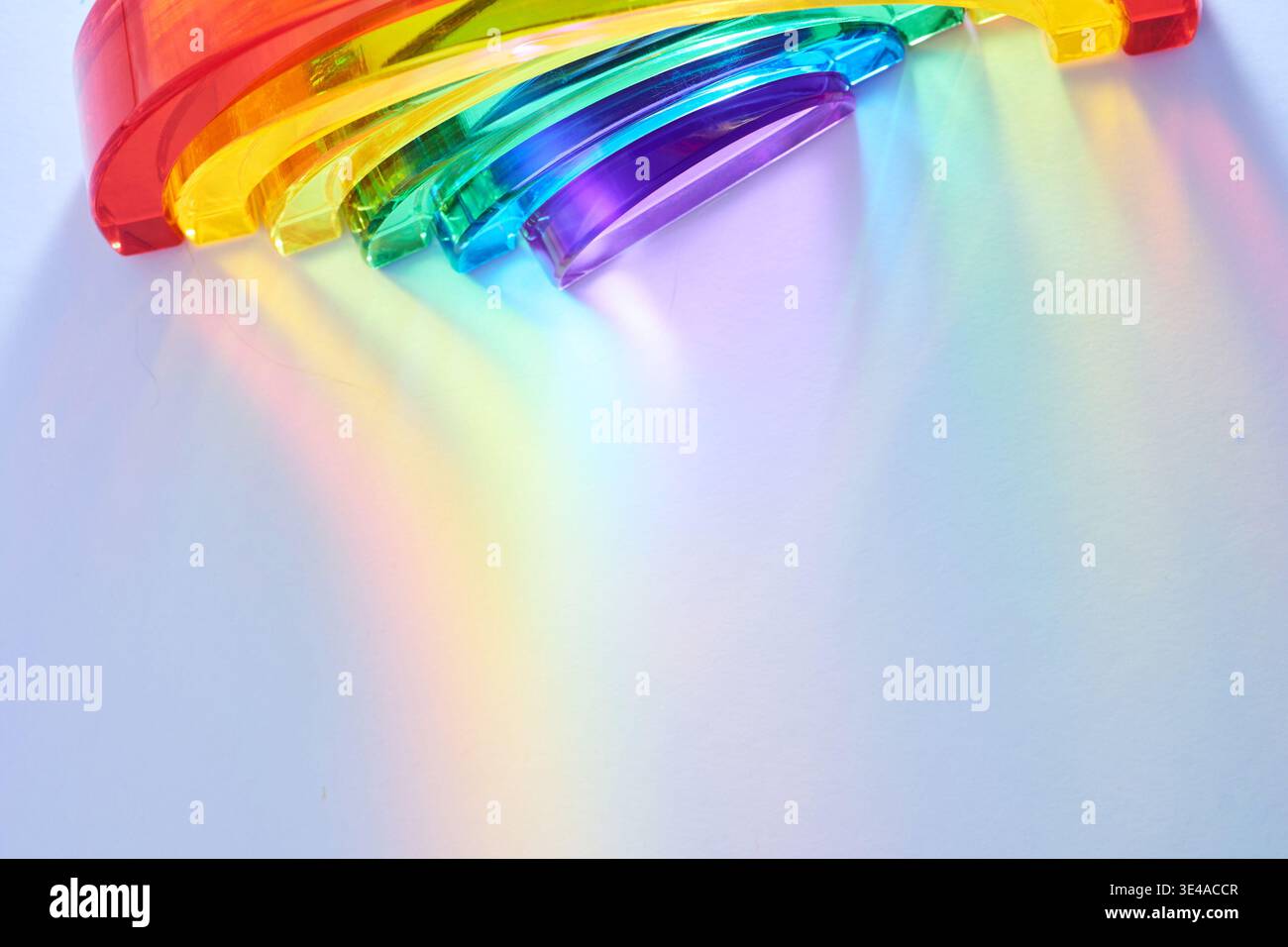 Rainbow spectrum light refracting through glass prism Stock Photo