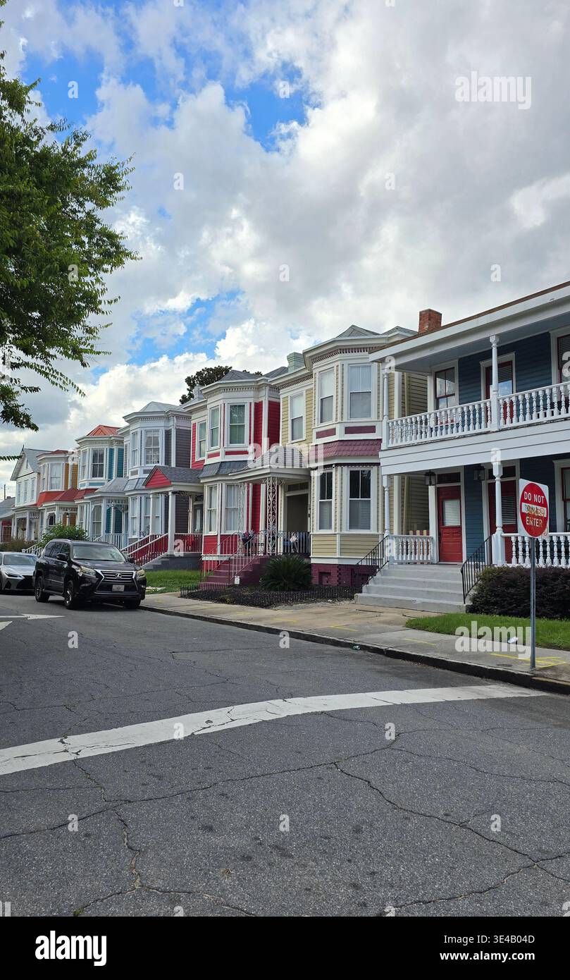 Row of colorful historic houses along residential street in Savannah, Georgia, USA, classic Southern architecture - Smartphone Captured Stock Image