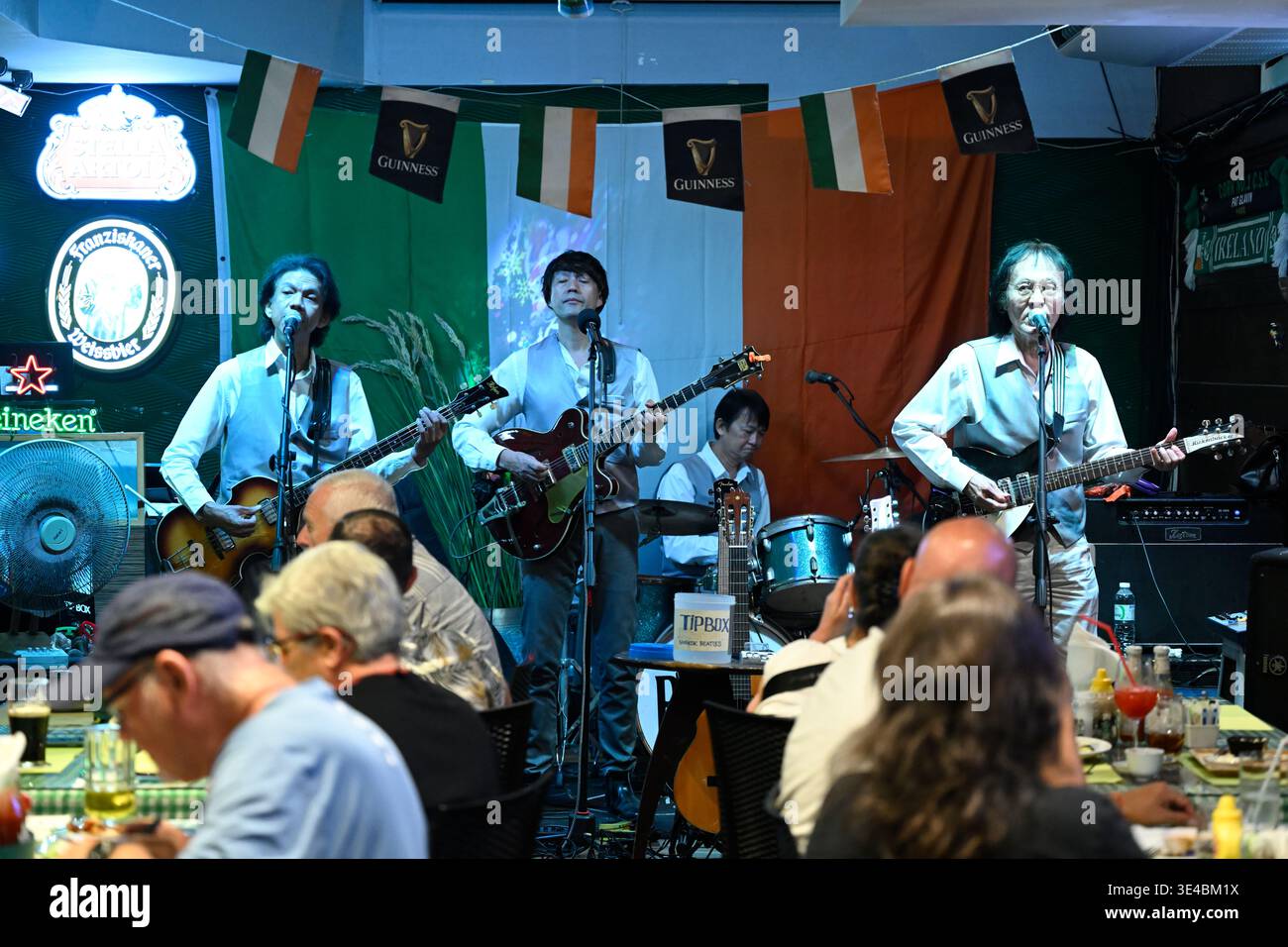 Beatles tribute band The Bangkok Beatles perform live in Hua Hin, Thailand. Stock Photo