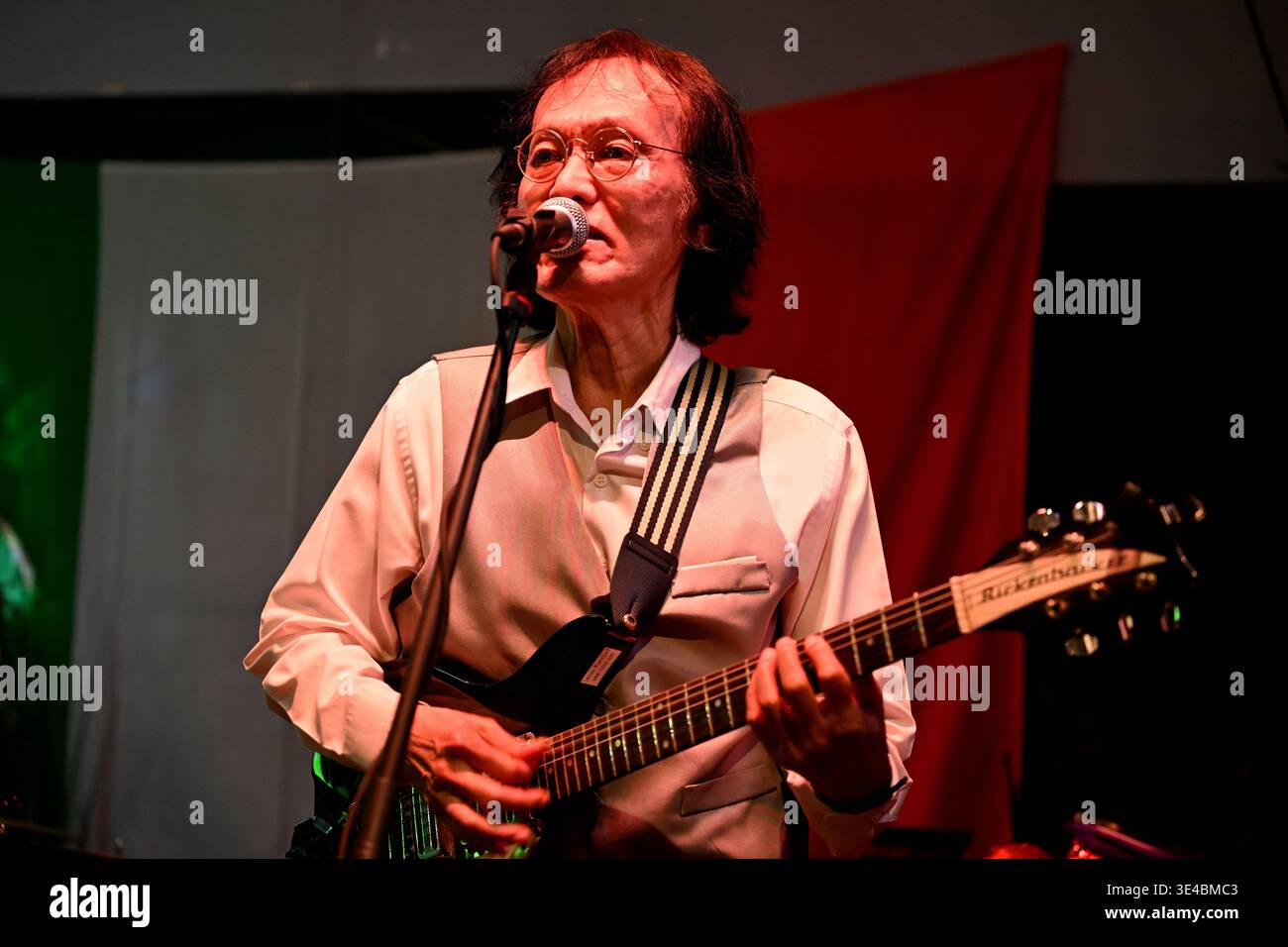 "John Lennon" performs live with the tribute band The Bangkok Beatles in Hua Hin, Thailand. Stock Photo