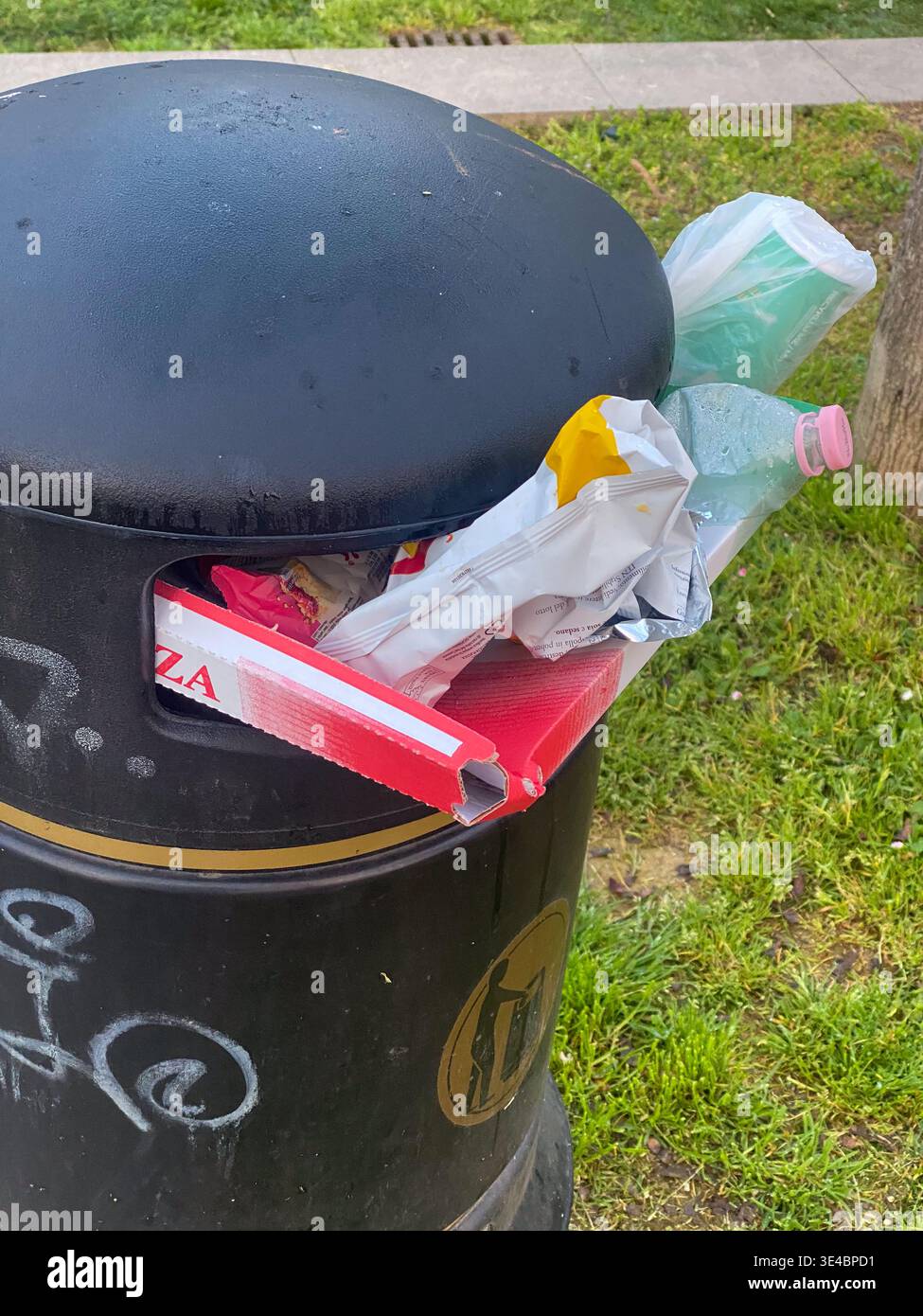 Cremona, Italy - March 11th 2026 Overflowing public waste bin filled ...
