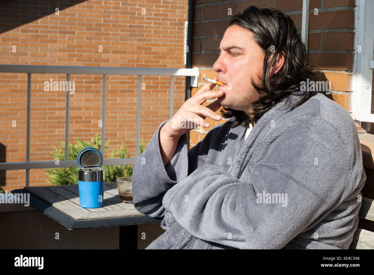 a client smoking in his bathroom has dropped a cigarette Solved tracheostomy care for and suctioning to Man in a bathrobe smoking