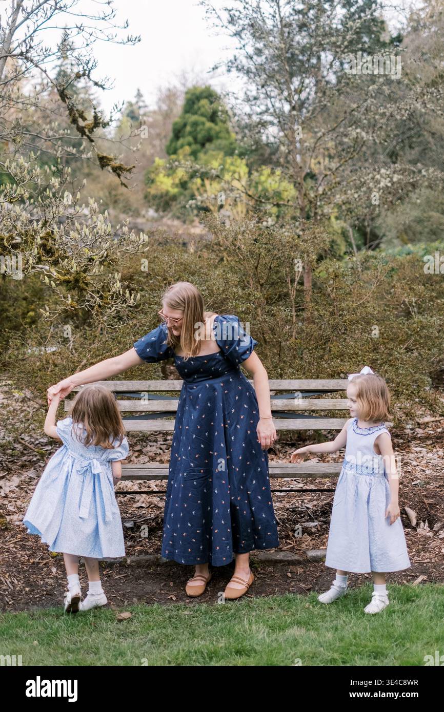 Girls twins in light blue clothes are posing on a blue background Stock Photo - Alamy Girls twins in light blue clothes are posing on a blue background Stock Photo - Alamy