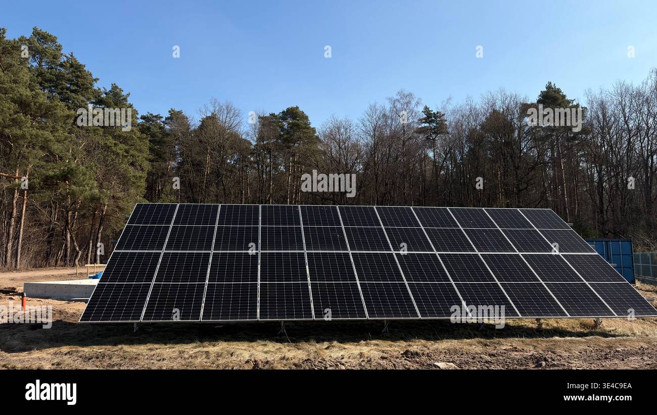 Solar Energy Installation at Forest Edge Sustainable Future Stock Photo