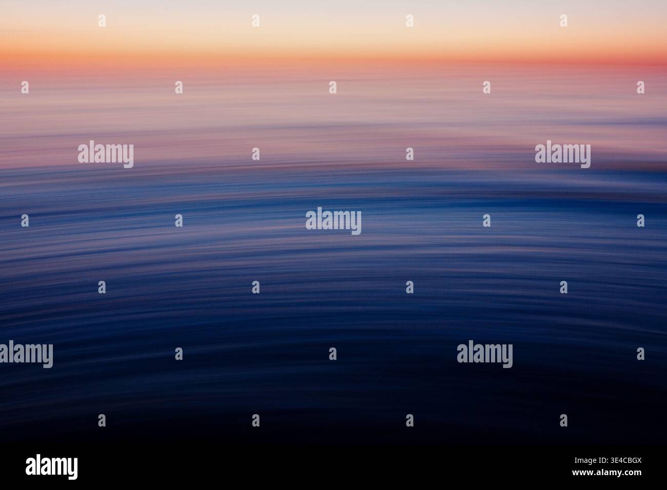 Abstract blue ocean motion blur with flowing wave patterns Stock Photo