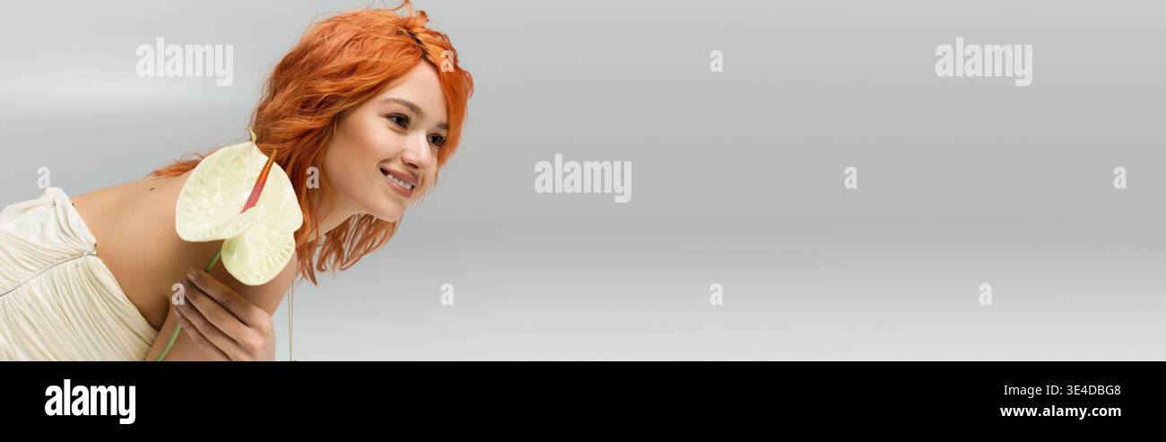 Red haired beauty in a strapless dress showcases spring style and confidence with charm, banner Stock Photo