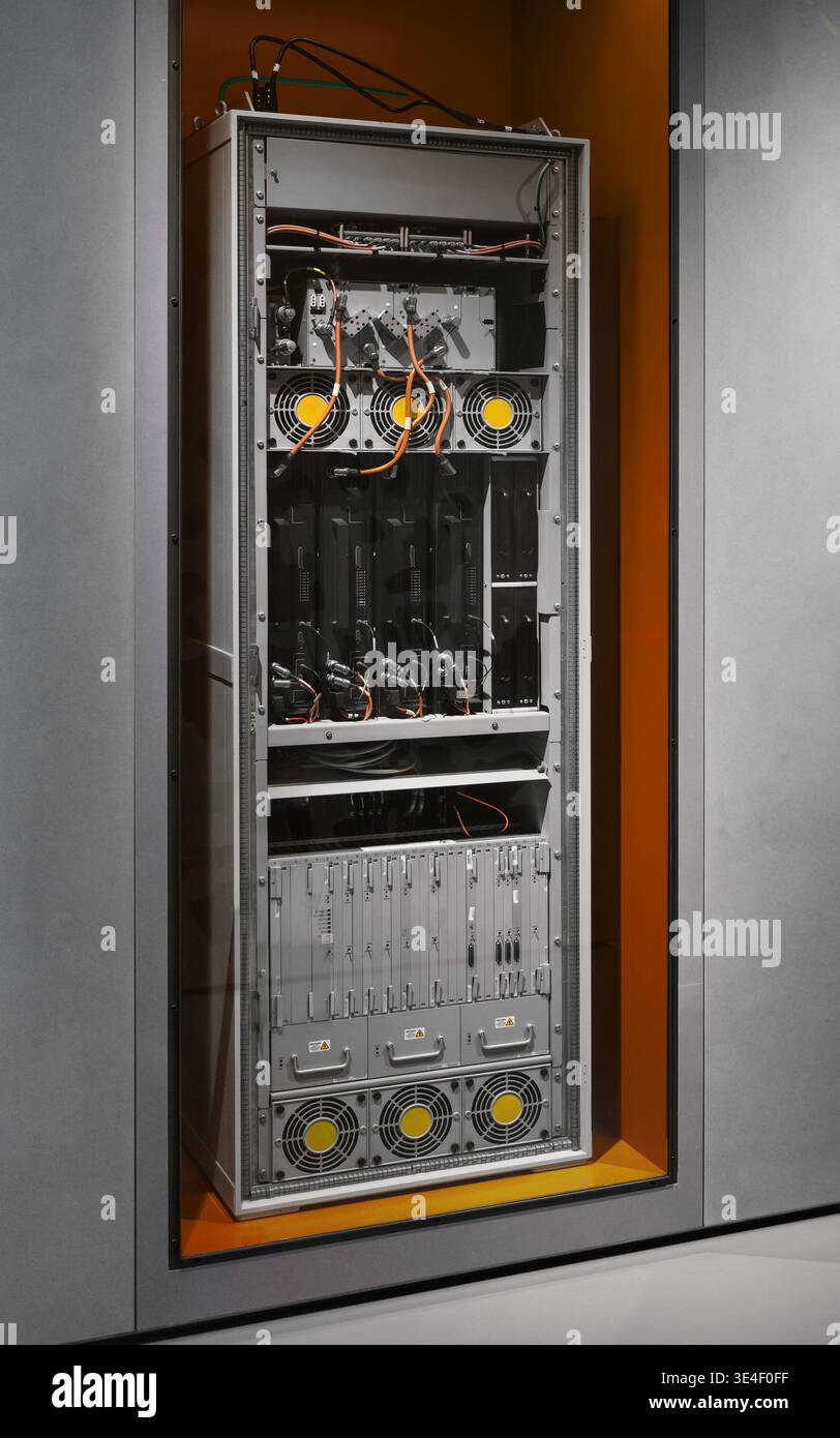 Industrial server rack and power distribution unit. A high-tech server rack with cooling fans, power modules, complex wiring - network infrastructure. Stock Photo