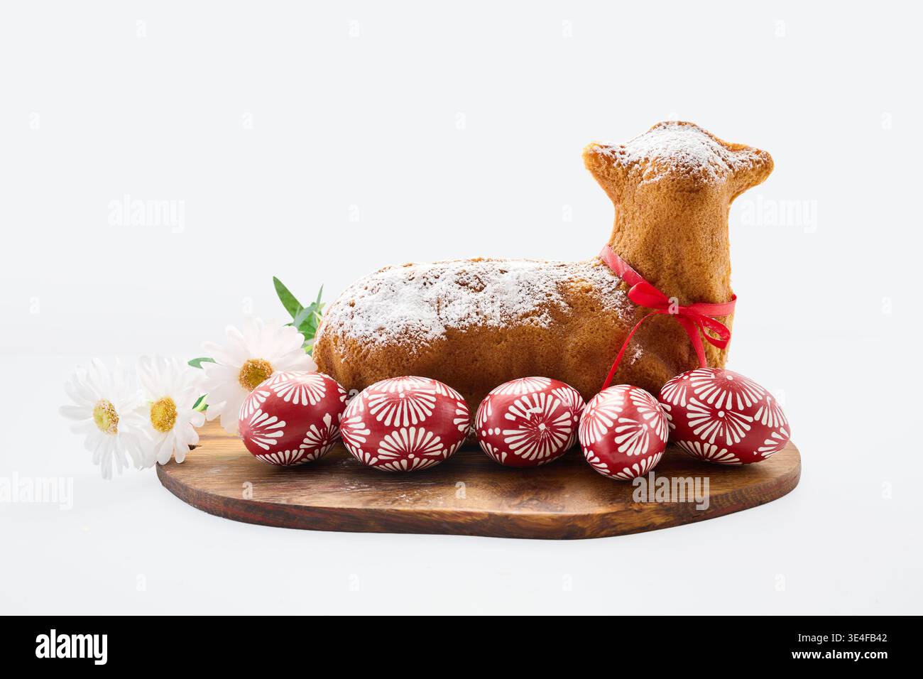 Easter lamb cake with decorated eggs and flowers Stock Photo
