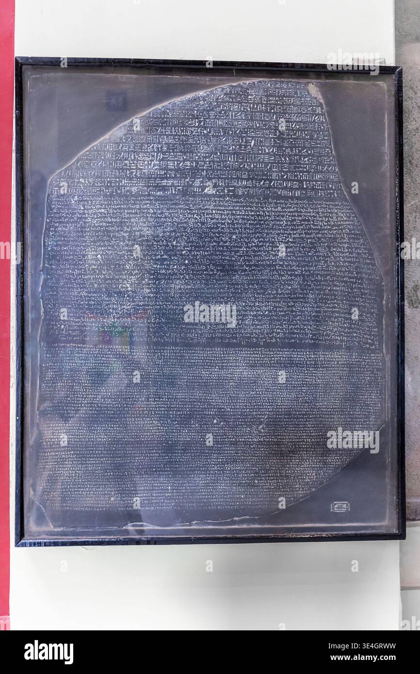 Cairo, Egypt, 24.07.21. The Rosetta Stone, black granite stele with Egyptian hieroglyphs and Greek inscriptions in the Egyptian Archaeology Museum. Stock Photo