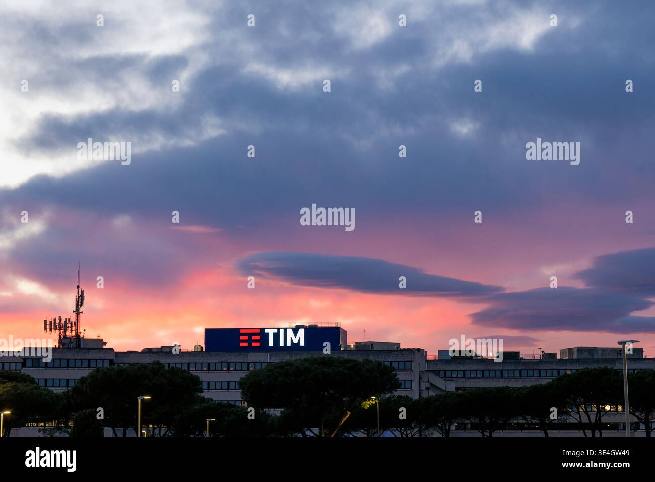 TIM headquarters building Via di Val Cannuta Rome. Telecommunications antennas and signage at dusk. Corporate technology infrastructure Italy Stock Photo