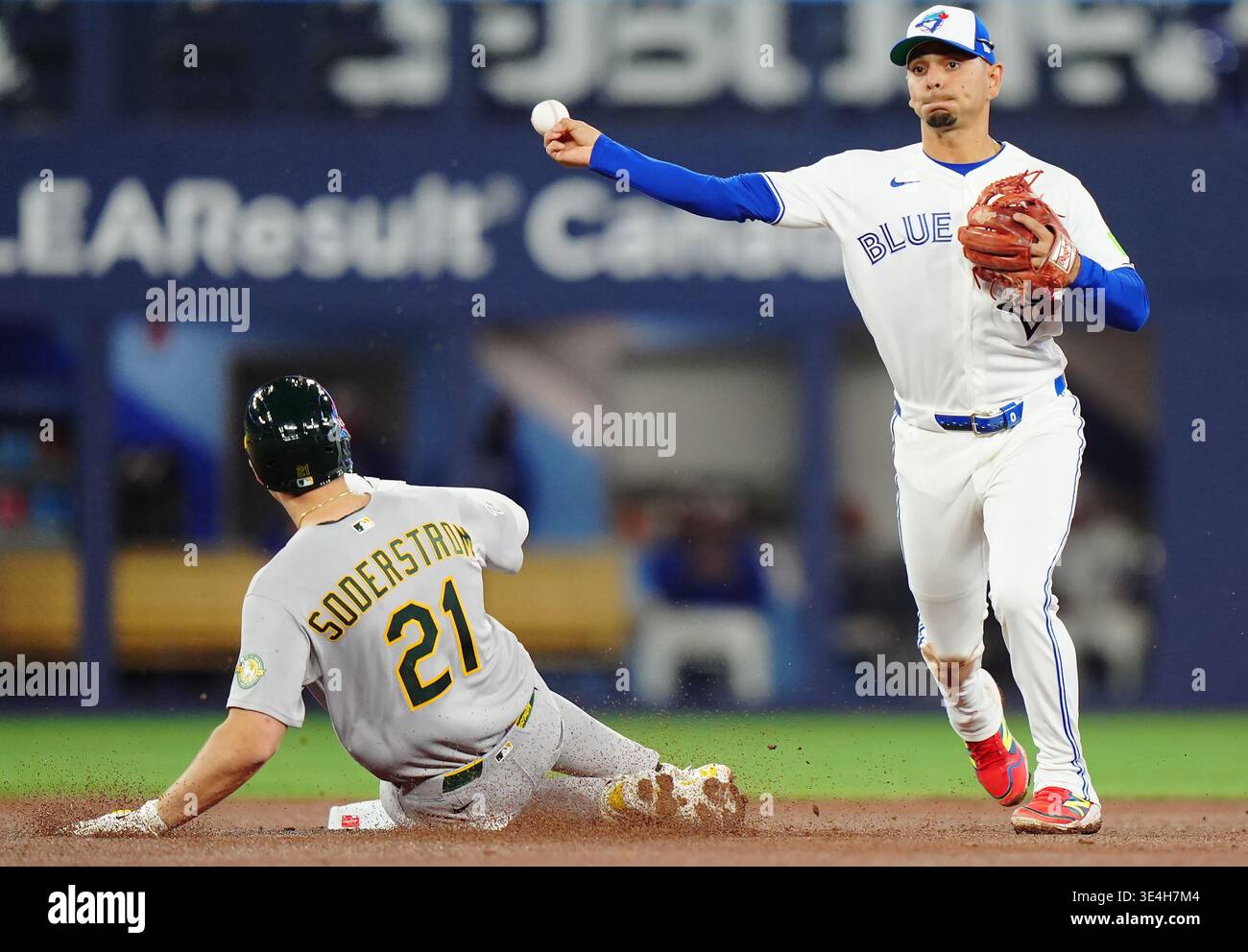 Toronto Blue Jays shortstop Andres Gimenez (right) forces out Athletics ...