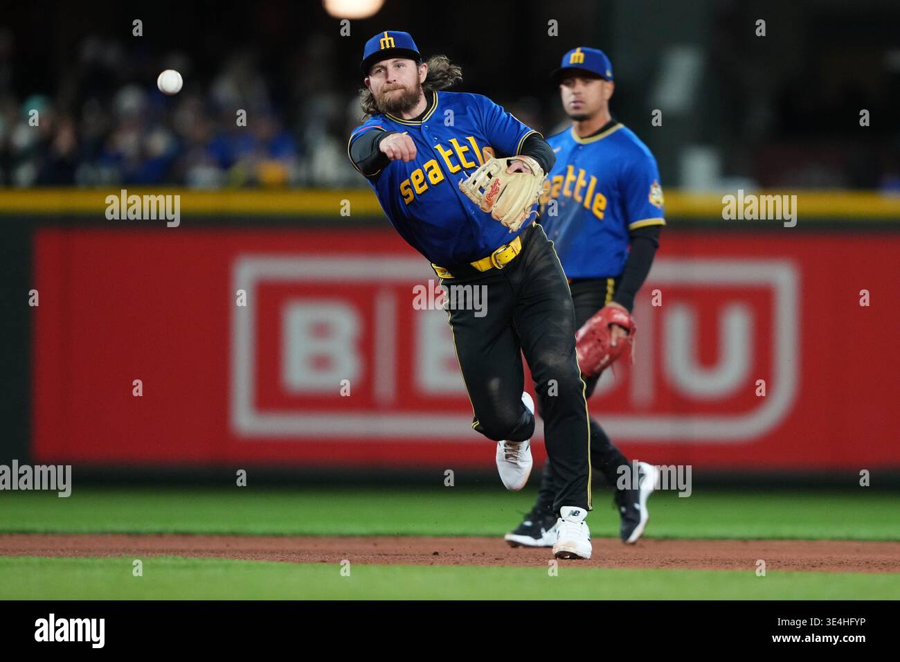 Seattle Mariners third baseman Brendan Donovan throws to first base for ...