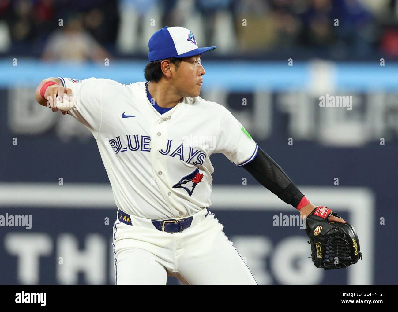 Toronto Blue Jays third baseman Kazuma Okamoto throws the ball to first ...
