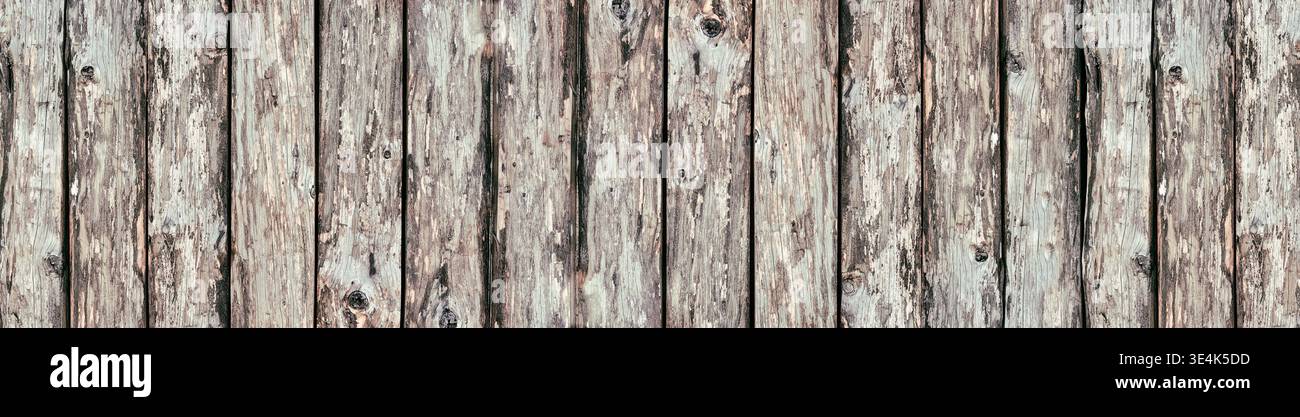 Wide rustic background. Rough wooden boards texture. Old knotty wood logs surface panorama Stock Photo