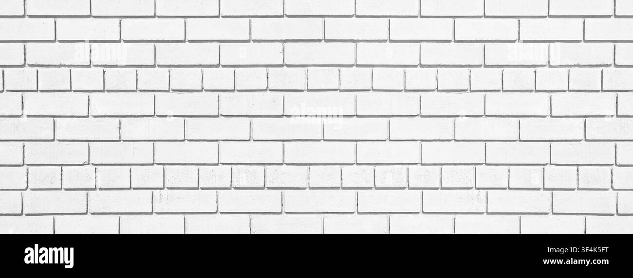 White brick long texture. Lime washed brickwork wide background. Light painted block wall abstract backdrop Stock Photo