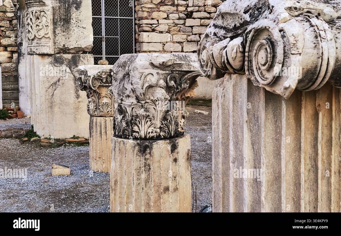 Fragmented Columns A detailed, eye-level shot focusing on three fragmented ancient columns ...