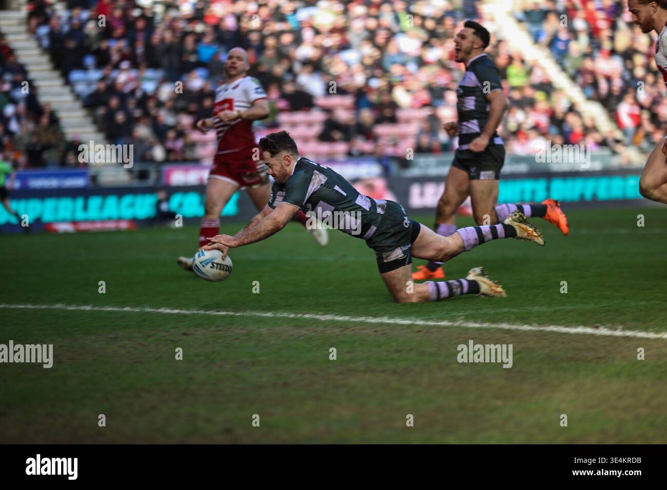 Adam Clune scores during the BetFred Super League match between Wigan ...