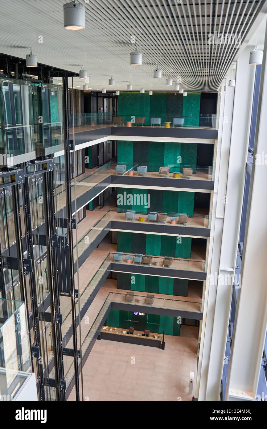 Multi Storey Atrium A high-angle interior view of a modern multi-story office building ...