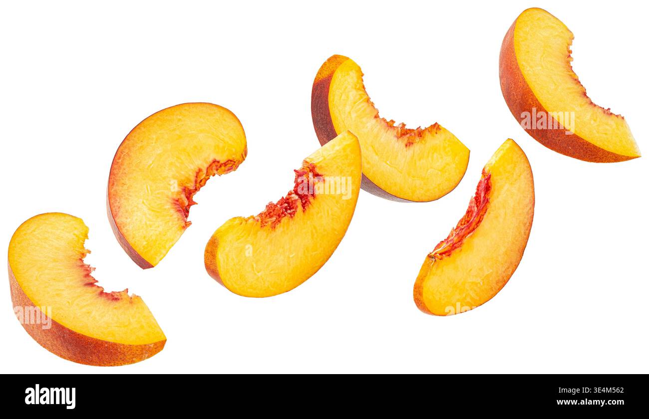 Falling peach slices isolated on white background Stock Photo