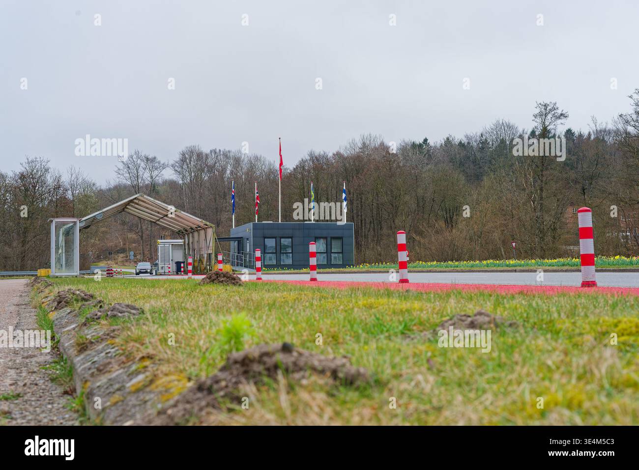 Border Checkpoint Images A border checkpoint featuring a small building with multiple flags ...