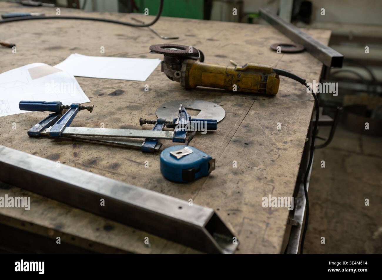 Tools and Equipment on a Workbench Displaying Various Measuring and Cutting Instruments in a Workshop Environment Stock Photo