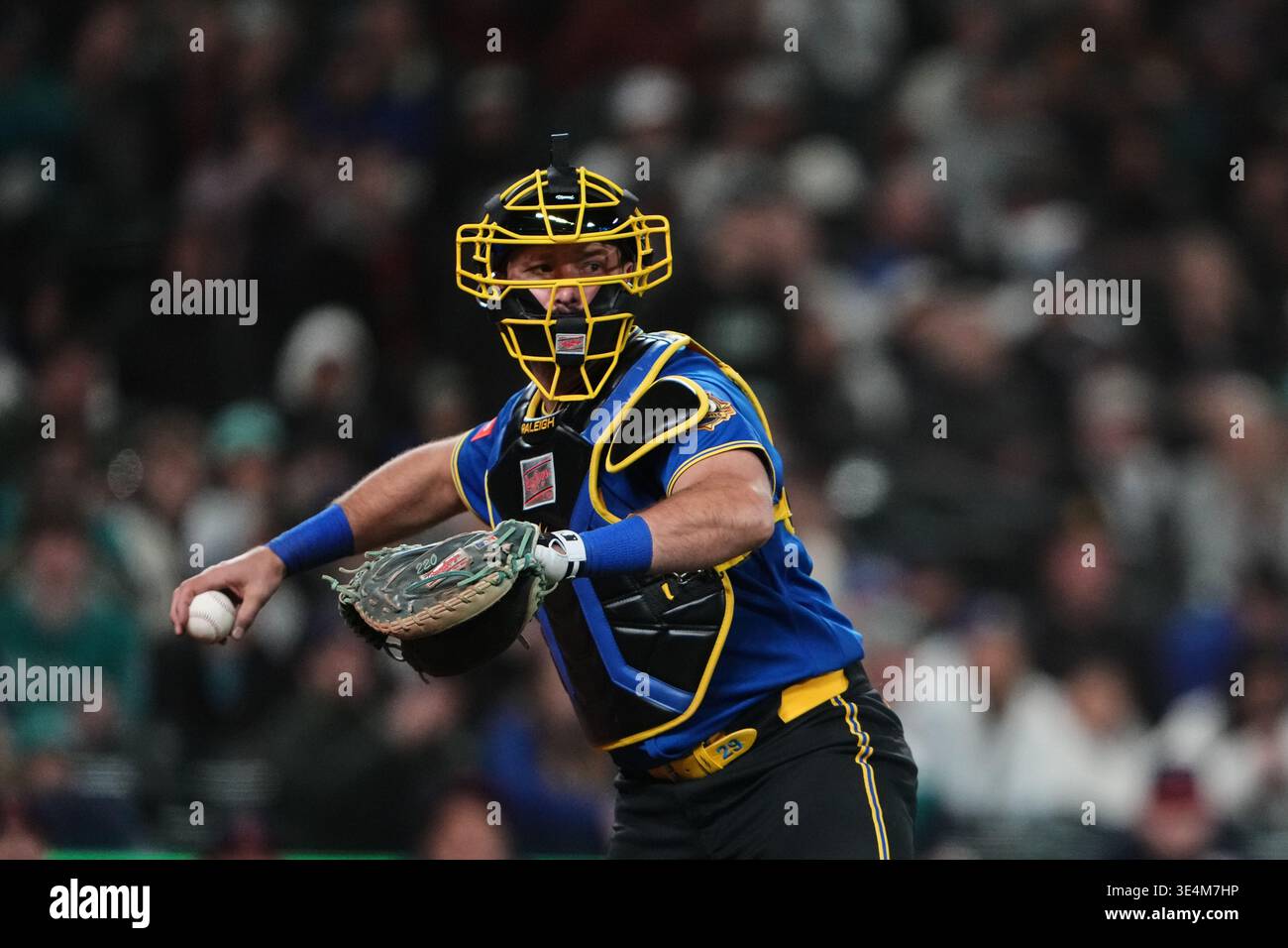 Seattle Mariners catcher Cal Raleigh throws to first base during a ...